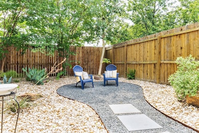 Fenced backyard with a patio area