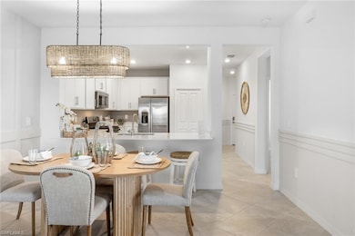 Dining area featuring light tile patterned floors and recessed lighting