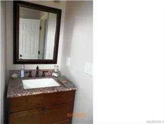 Granite vanity in walk through bath upstairs