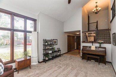 Great room view of front entry and stairs to 2nd l