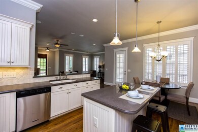 Kitchen includes an eat-in breakfast area, island,