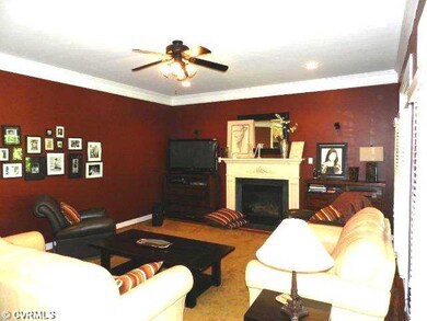 Living Room - Open to Kitchen and sunroom with a f
