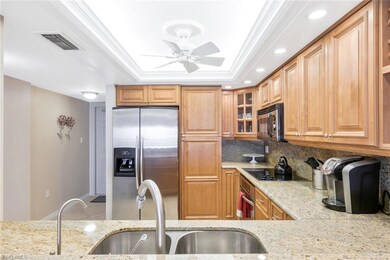Kitchen featuring ceiling fan, tasteful backsplash