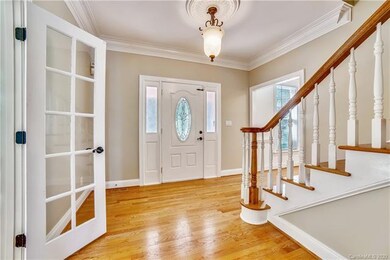 Neutral paint and beautiful hardwood flooring thro