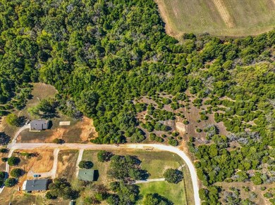 Birds eye view of property featuring a rural view
