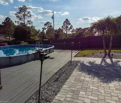 View of swimming pool featuring a deck