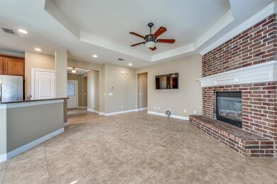 Kitchen opens to living area and has space for bar