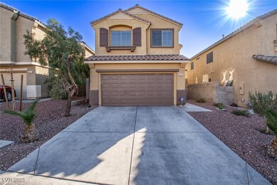 View of front of house with a garage, stucco sidin