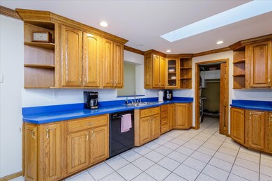 Spacious Kitchen with Custom Cabinets and Tile Bac