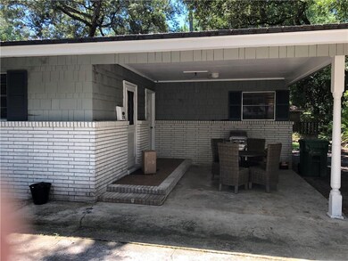 carport view on 1 bedroom apt side