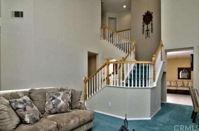 Traditional staircase with oak handrails and balus