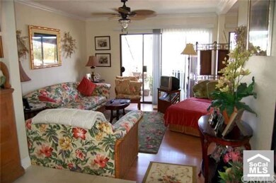 Light and bright living room.  Balcony located off