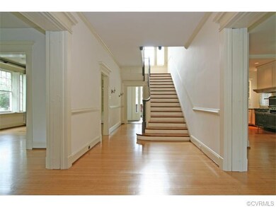 Center hall is open to the living and dining rooms, the family room that opens to the kitchen, the back hall and rear entrance.  The Palladian window on the landing fills the hall with light.