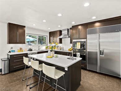 Built in Fridge - wine cooler, double ovens.
