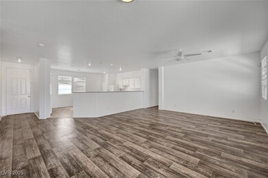 Unfurnished living room with dark wood finished fl