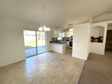 Eat-in kitchen with sliding doors to back yard