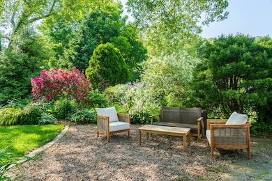 Outdoor rear yard area with casual seating.