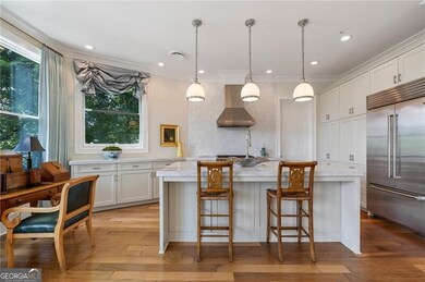 Chef's kitchen with top of the line appliances and upgraded marble countertops