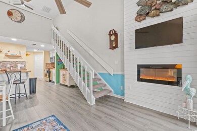 Interior space with a high ceiling, ceiling fan, h