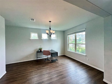 Dining area with dark wood-style floors, healthy 