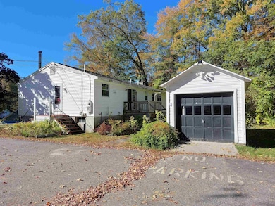 One car garage and paved parking