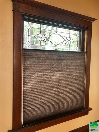 Main Level has split blinds on the large windows