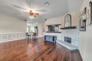 Notice the stone fireplace and hearth, both upgrad