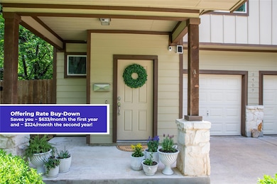 View of exterior entry with a porch, board and ba