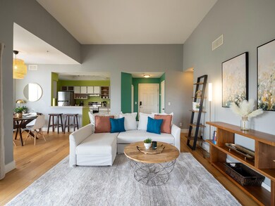 Living room with light wood-style floors and baseboards