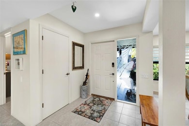 Entrance foyer featuring light tile patterned floo