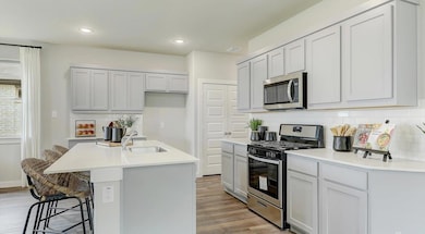 Kitchen featuring appliances with stainless steel