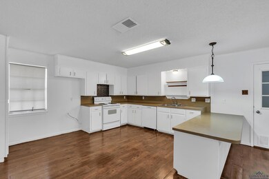 Kitchen featuring white appliances, sink, kitchen 