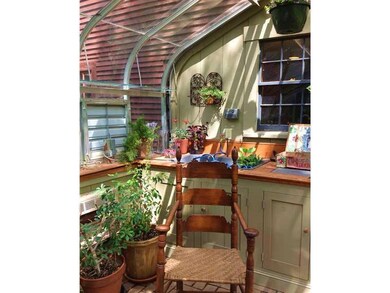 Janco Greenhouse with brick...