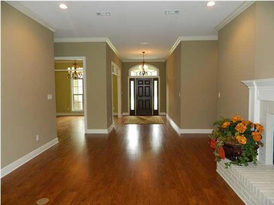 The elegant foyer welcomes you into this beautiful house. The wood floors flow through the formal areas.