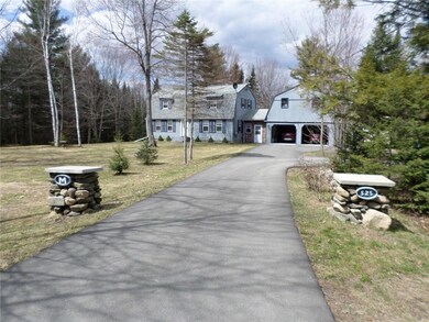 Front of home and front yard as...