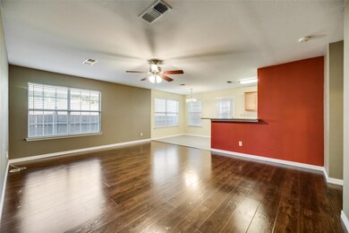 Spare room with dark hardwood / wood-style floors 