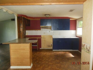 kitchen has built-in range hood and nice cabinet l