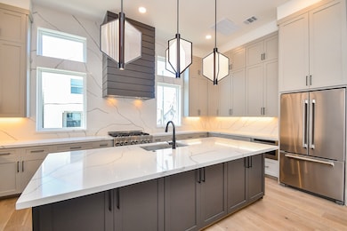 Spacious kitchen featuring premium Jenn Air applia