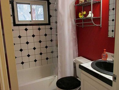 Full Bath. Updated bath with custom tile surround.