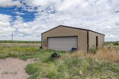 OVER SIZED GARAGE WITH CONCRETE FLOOR AND ELECTRIC