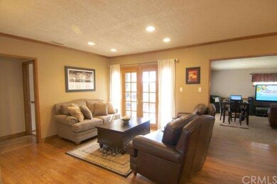 Custom French doors open to the backyard.  