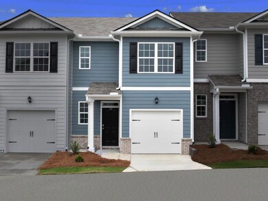 Pearson townhome exterior with blue color vinyl an