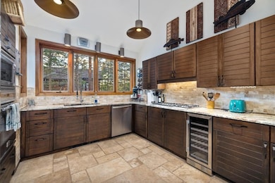 Kitchen with wine cooler, appliances with stainles