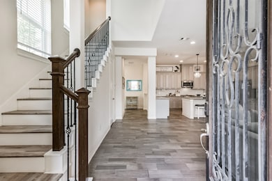 Enter to high ceilings and an open concept floor p