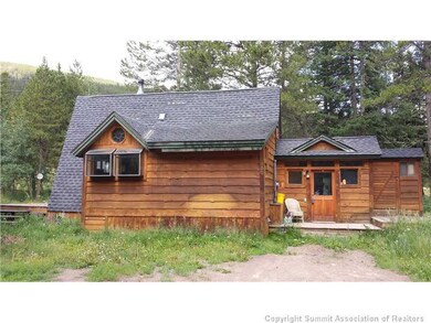 Exterior Front. Decks on both front and back of ho