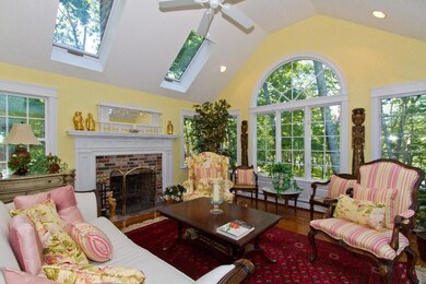 Living rm w/ wood fireplace and...