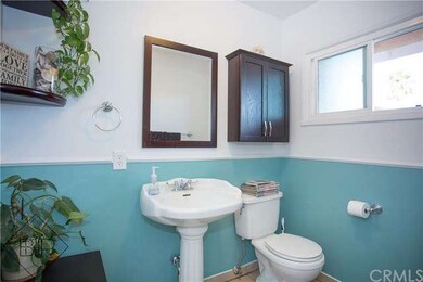 Gorgeous half bath with updated dual pane window.