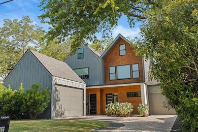View of front of home featuring a garage, drivewa