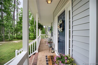 Large porch that wraps around to the side of the h