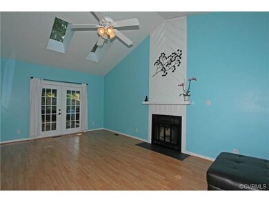 Huge Family Room with laminate wood flooring, wood